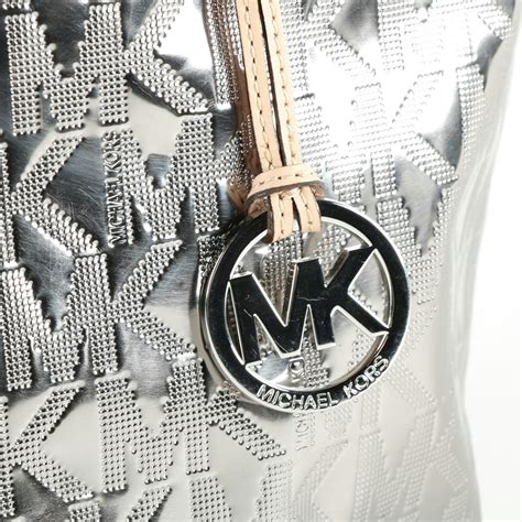 michael kors black purse with silver hardware|Michael Kors metallic silver handbags.